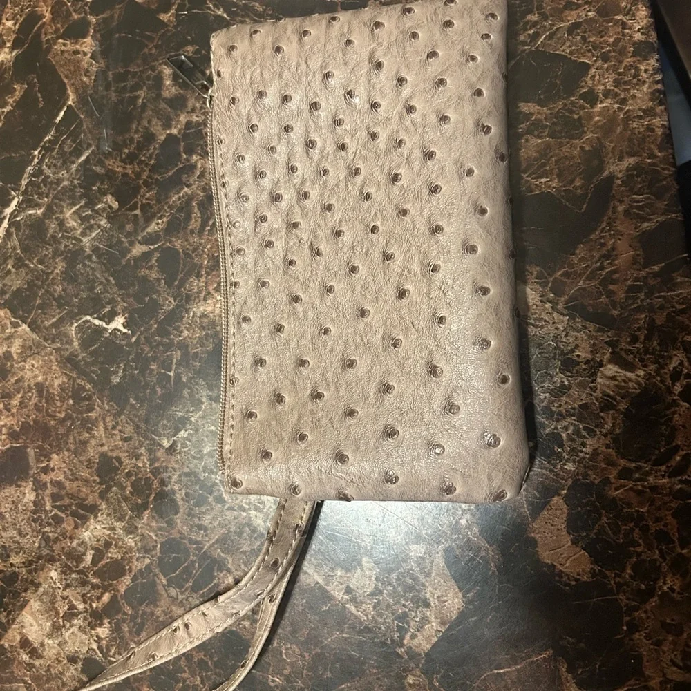 Beige Ostrich textured wristlet with polka dot lining